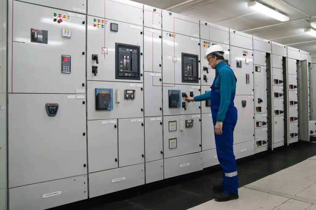 A Technician about to Access Electrical Switchgear like that which Spike Electric Controls produces.