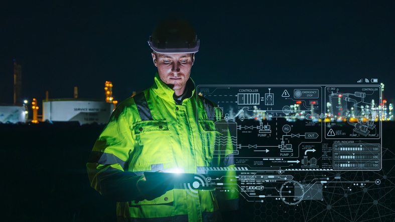 Modern technology oil and gas refinery engineer worker using advance digital device monitor service in petroleum industry pipe plant.